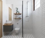a bathroom with a black and white checkered floor