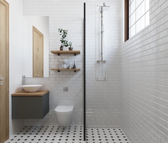 a bathroom with a black and white checkered floor