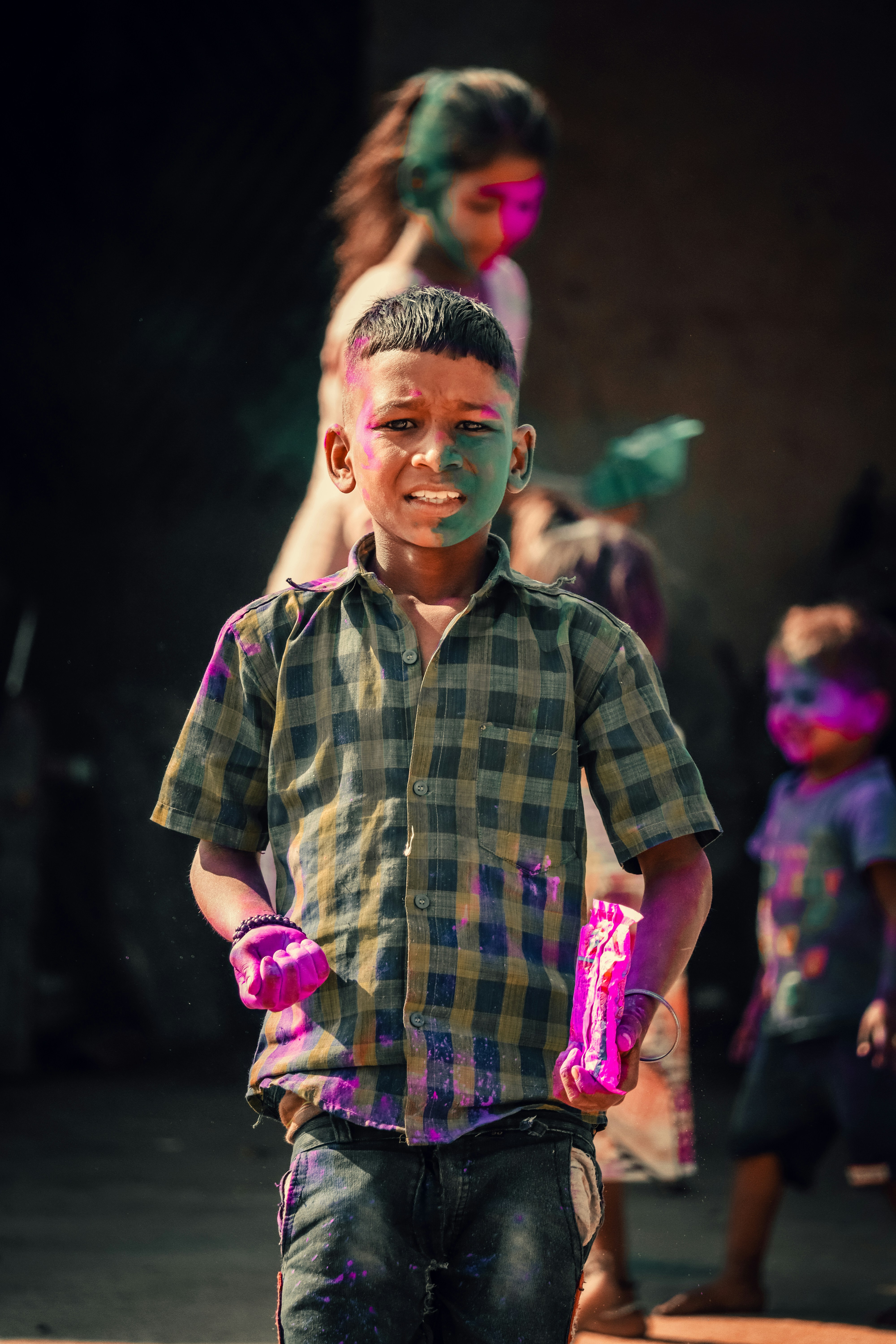 a young boy with paint all over his face