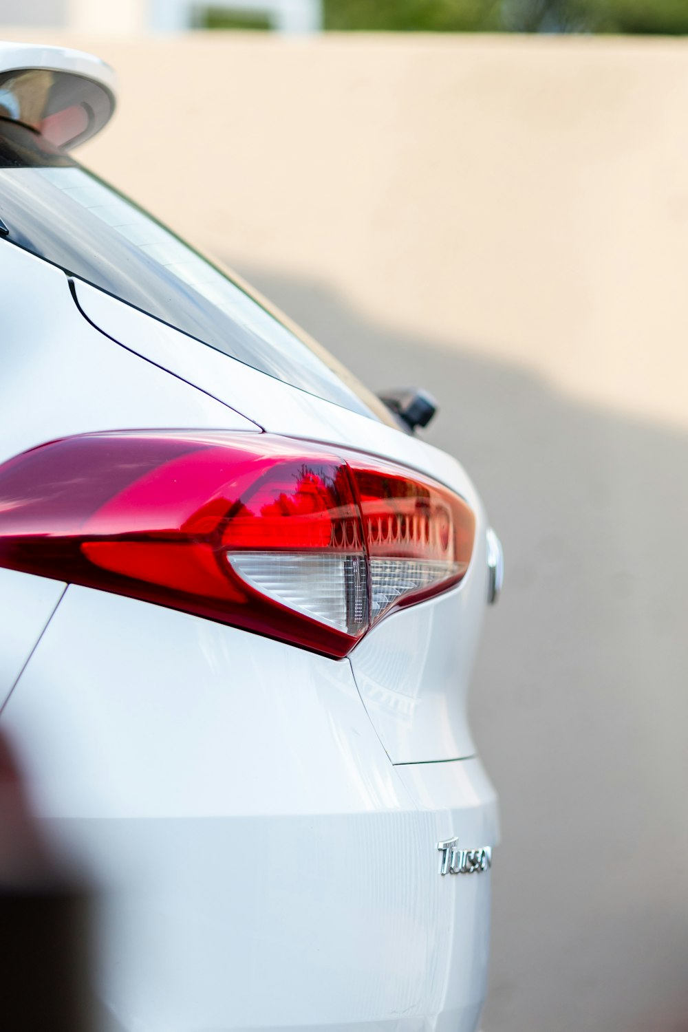 a close up of the tail light of a white car