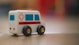 a toy ambulance is sitting on the floor