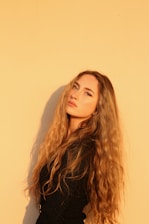 Beautifully styled natural hair with soft, flowing extensions in warm Houston light.