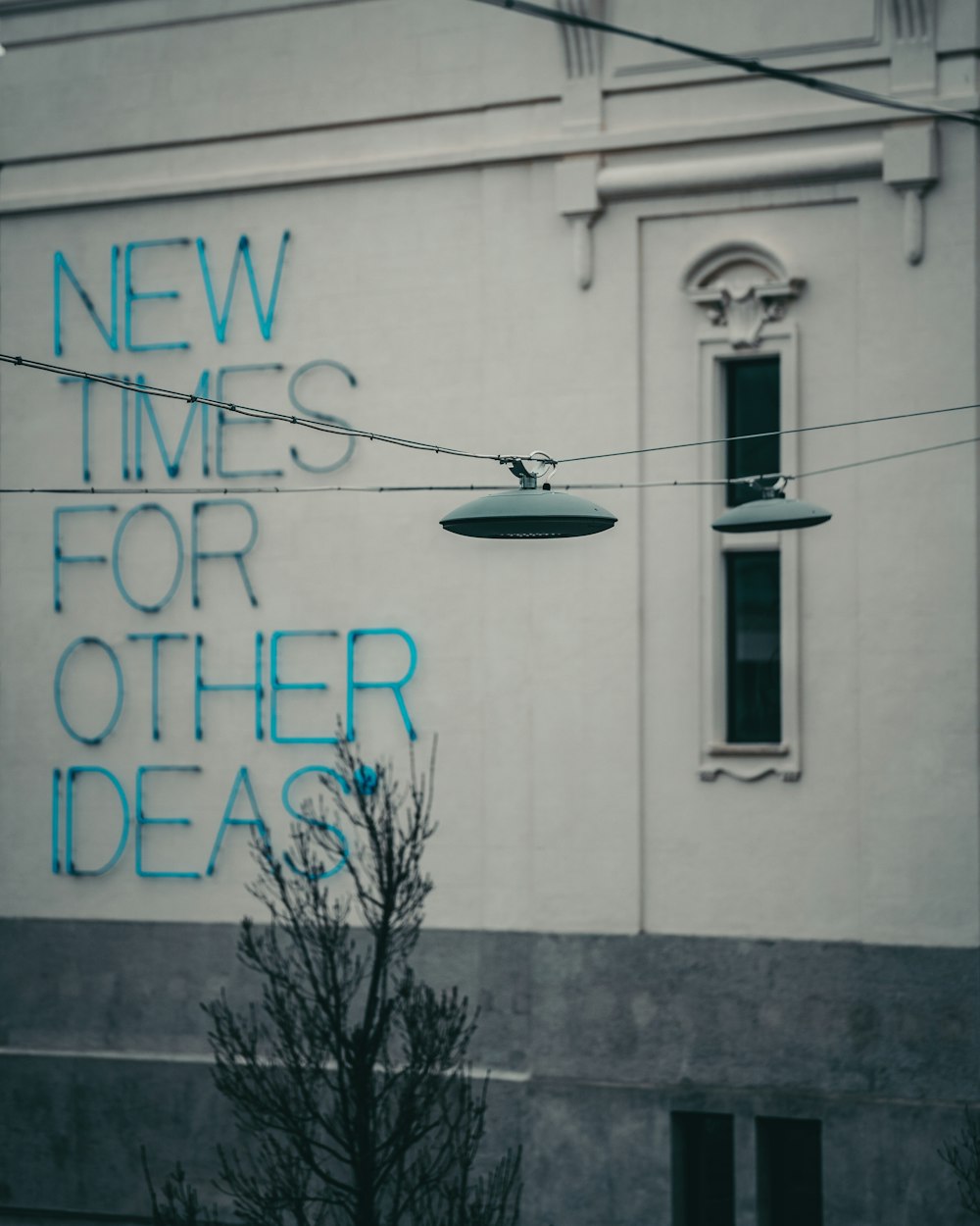 a building with a sign that says new times for other ideas