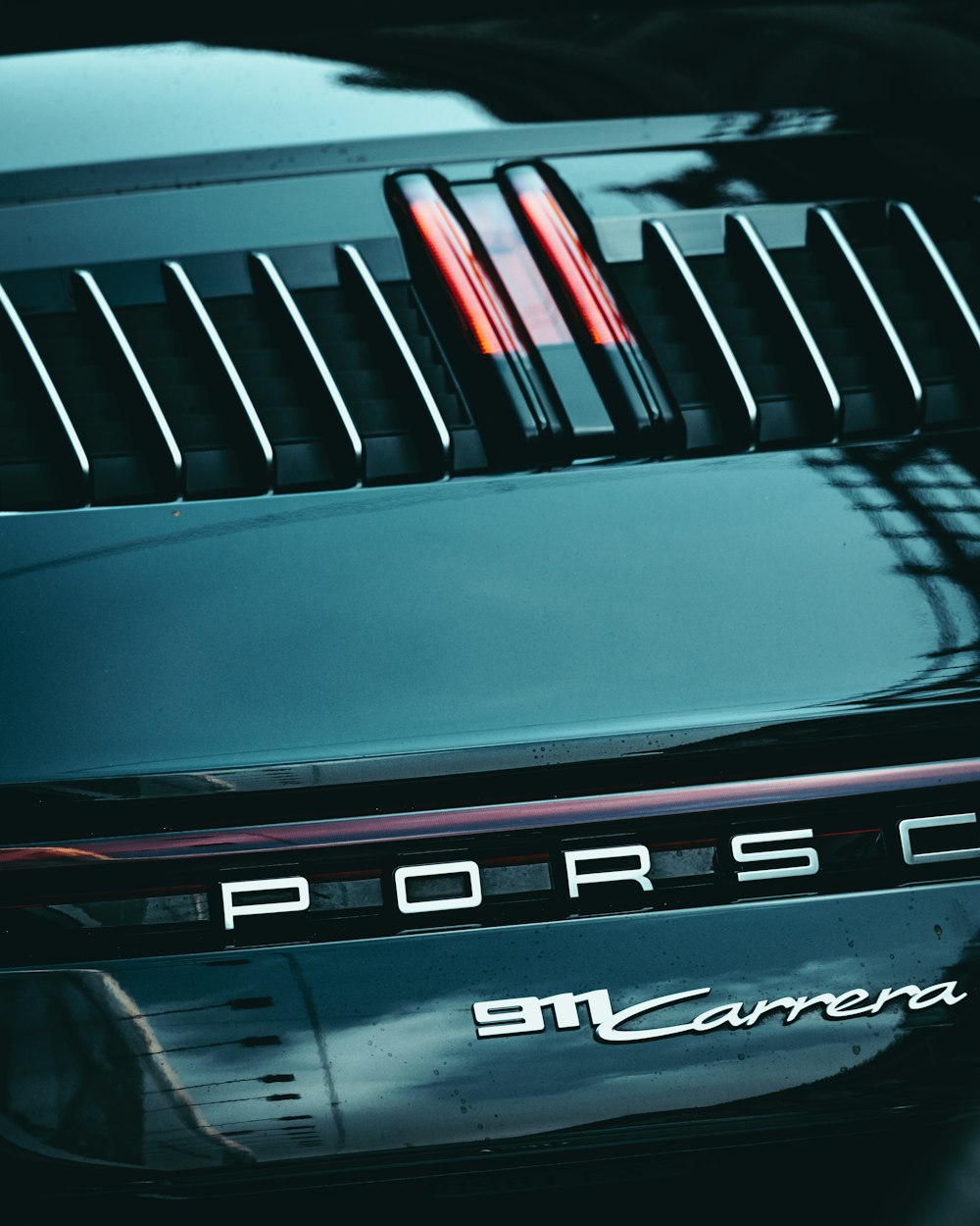 a close up of a porsche logo on a car