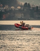 a man riding a boat on top of a body of water
