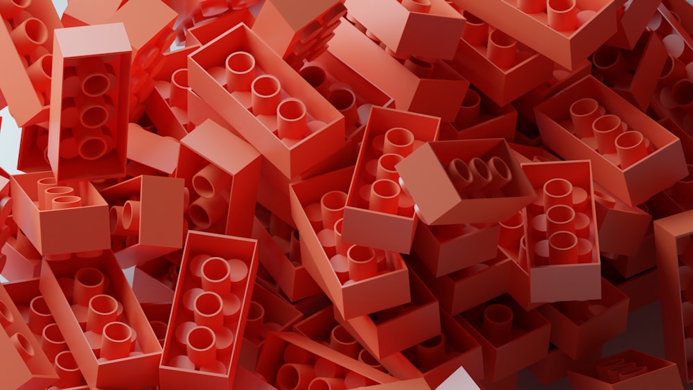 a pile of red legos with numbers on them