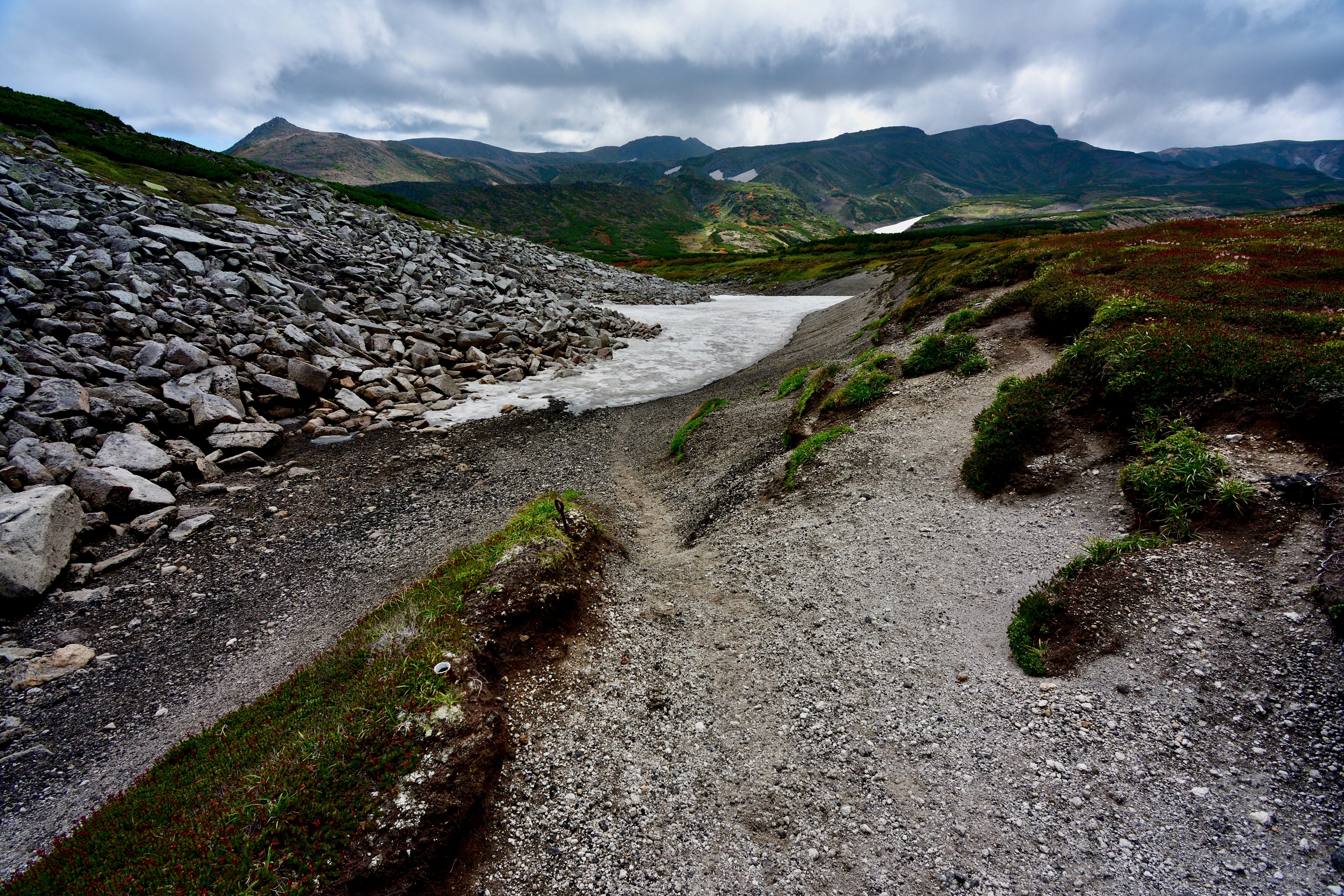 A snow valley that has melted quite a bit.
