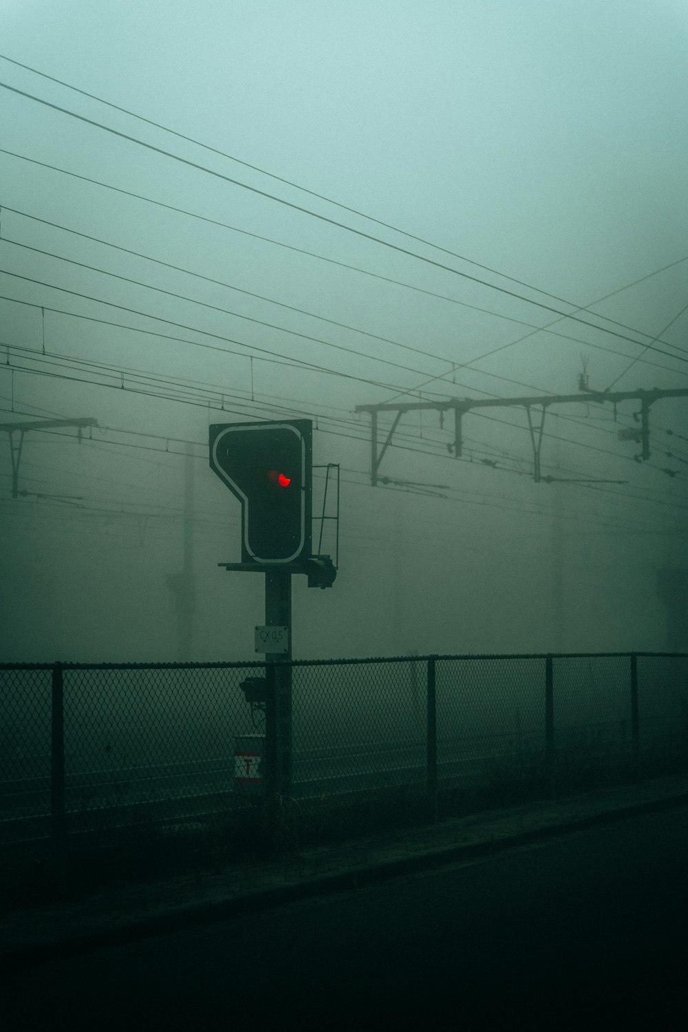 a traffic light sitting on the side of a road