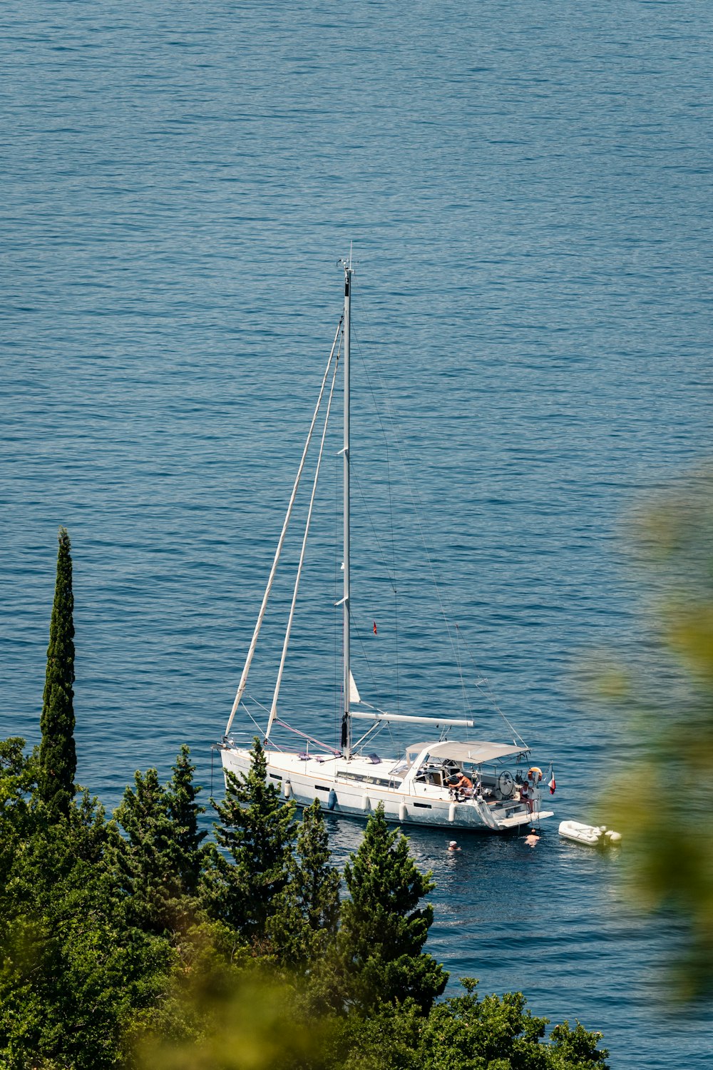 a sailboat in the middle of a body of water