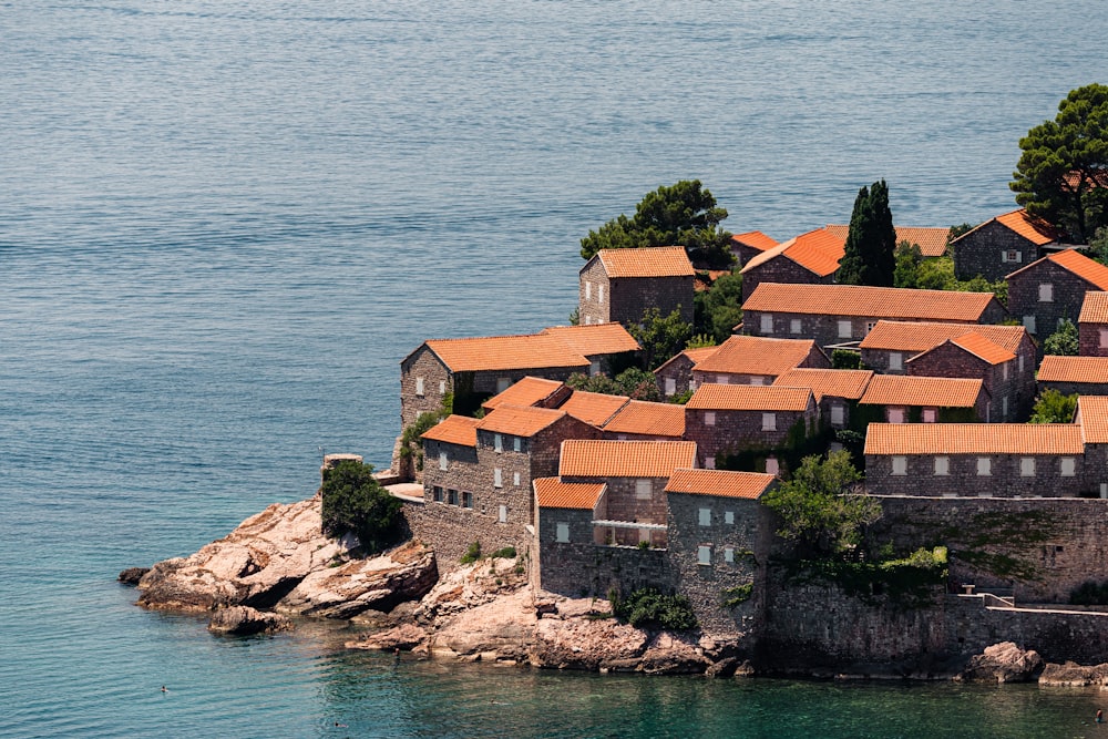 a small island with a bunch of houses on top of it