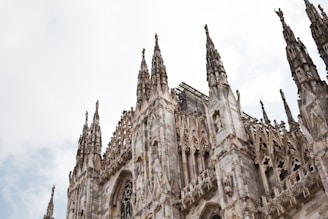a large cathedral with a clock on the front of it