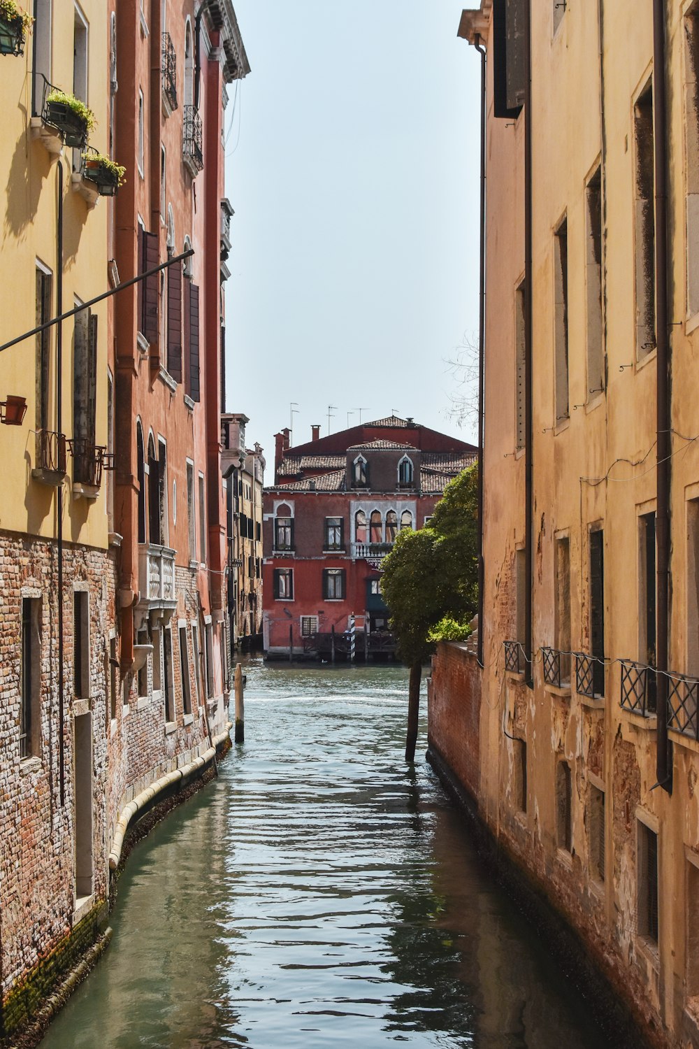 a narrow canal running between two buildings in a city