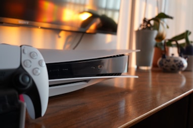 a video game system sitting on top of a wooden table