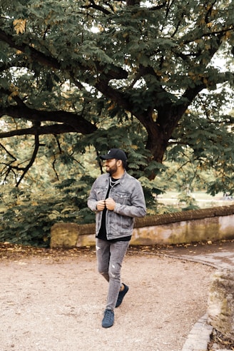 a man in a black hat is running