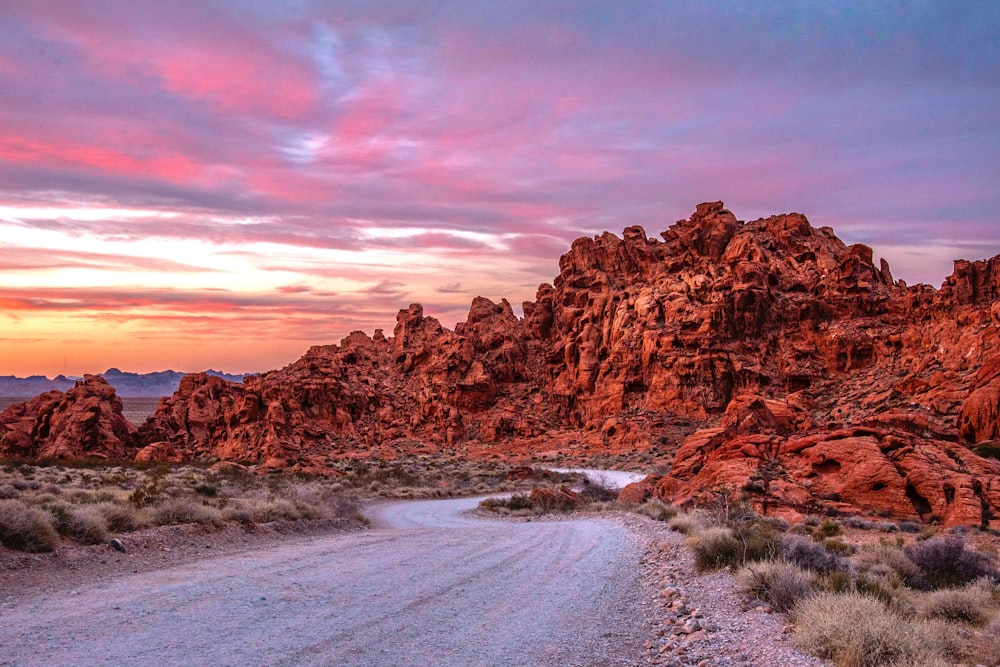 a dirt road in the middle of a desert