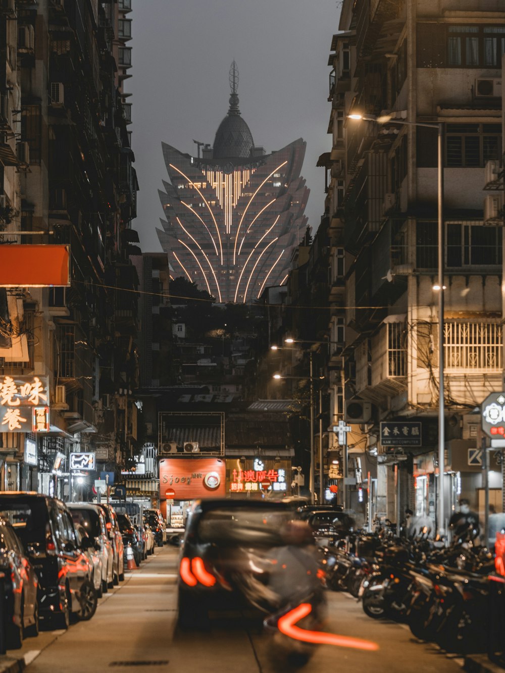 a city street filled with lots of parked motorcycles