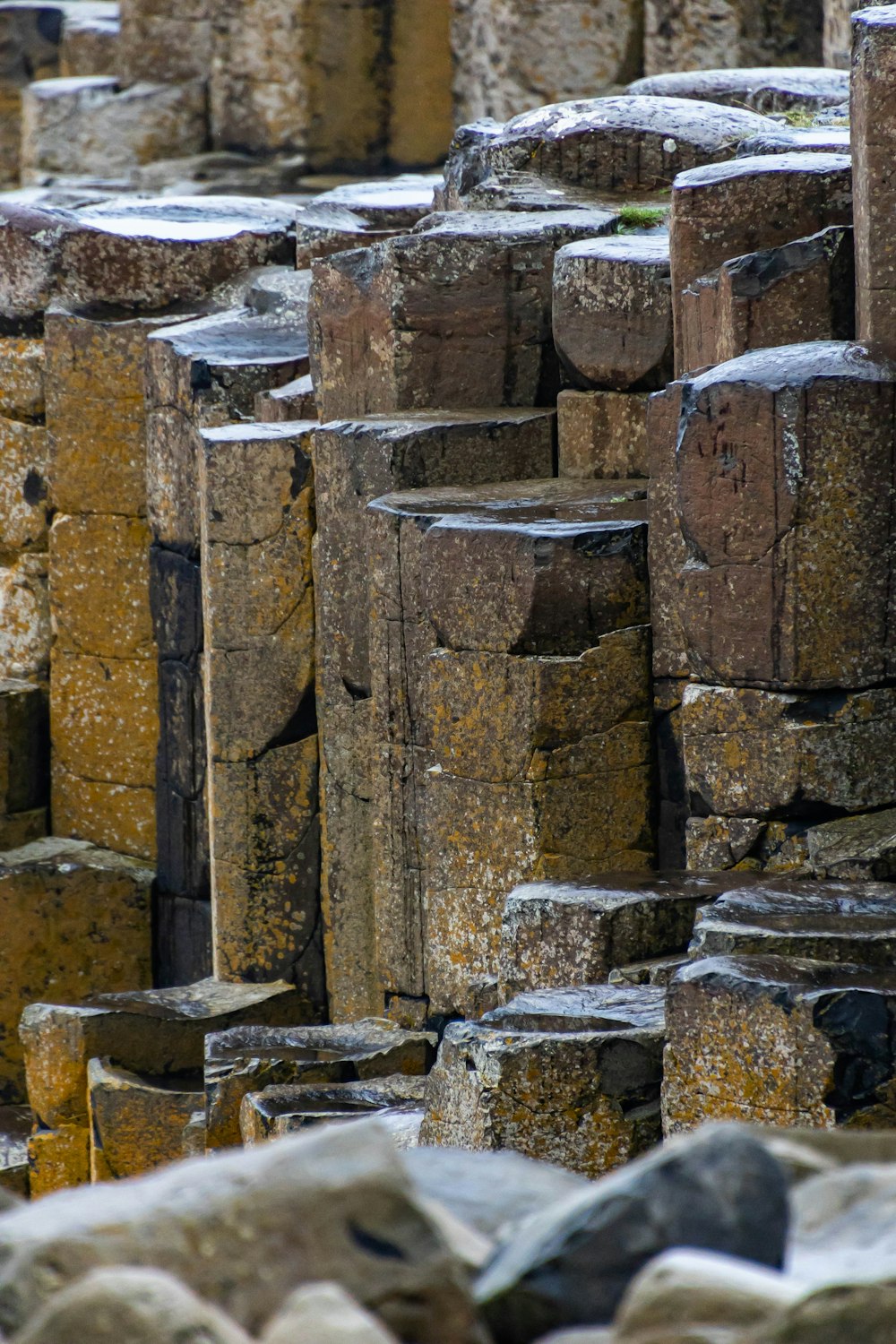 a large group of stone blocks stacked on top of each other