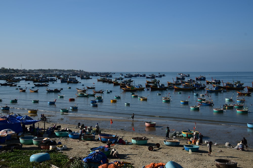 a group of boats floating on top of a body of water