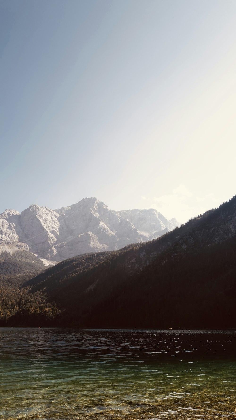 the mountains are covered with snow in the distance