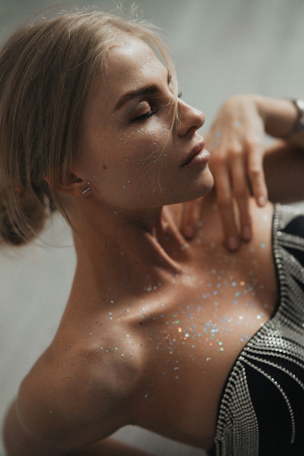 a woman with glitter all over her body