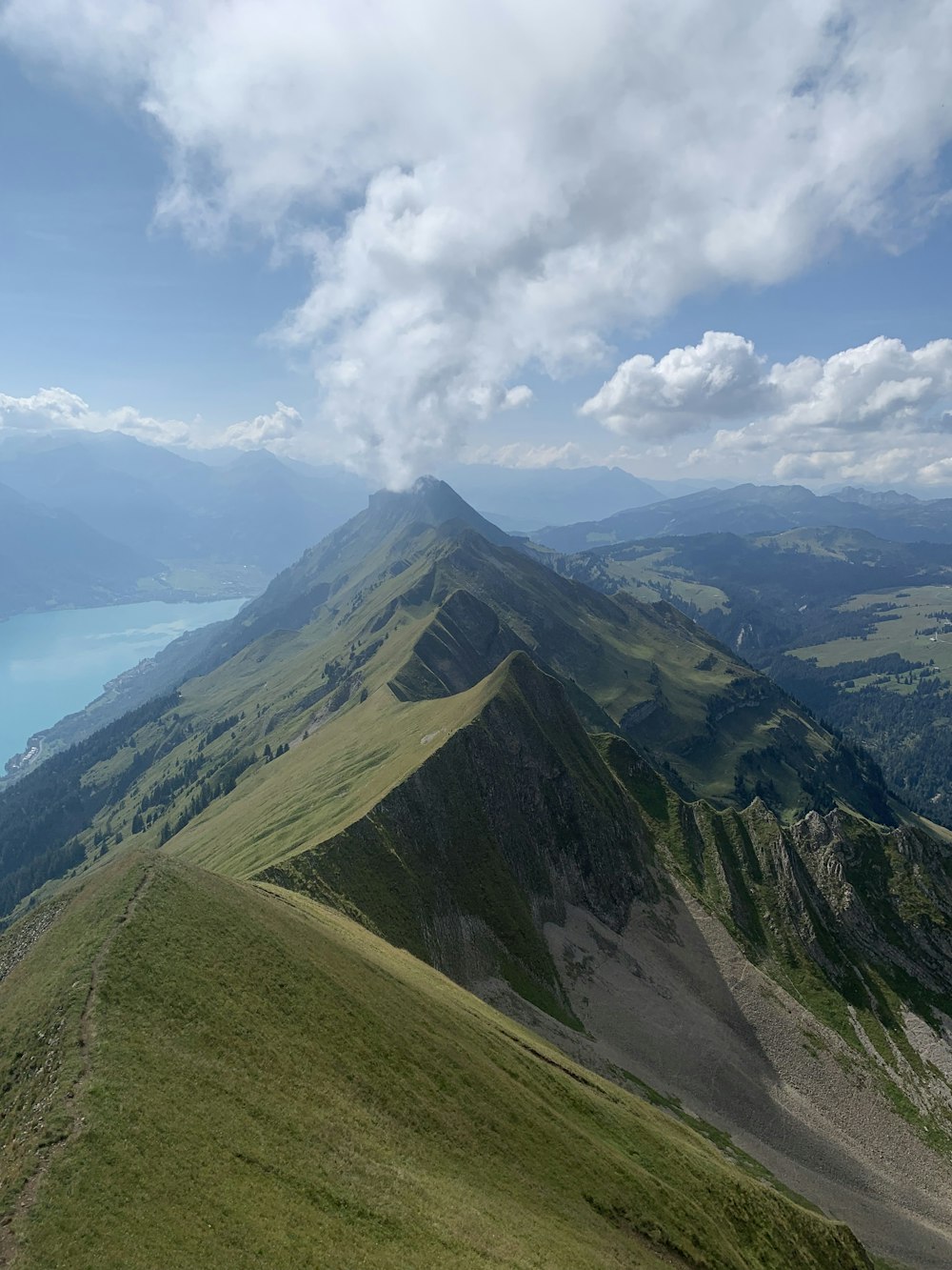 a view of a mountain range with a lake in the distance