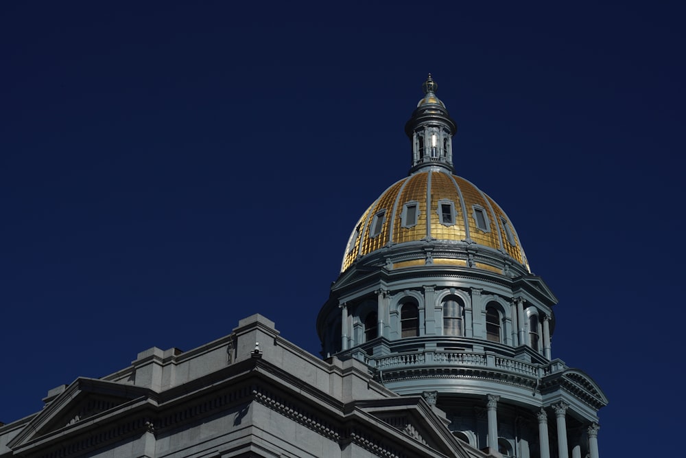 the dome of a building with a clock on it