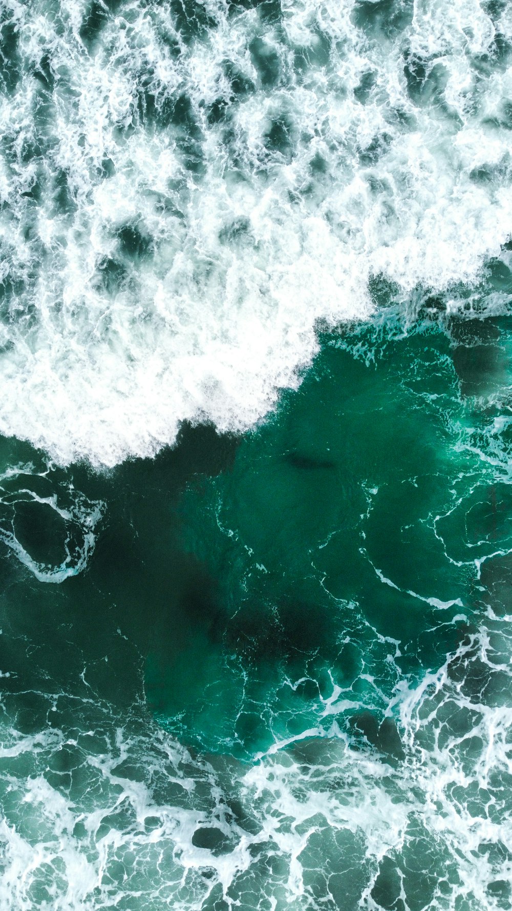 a large body of water with waves coming in