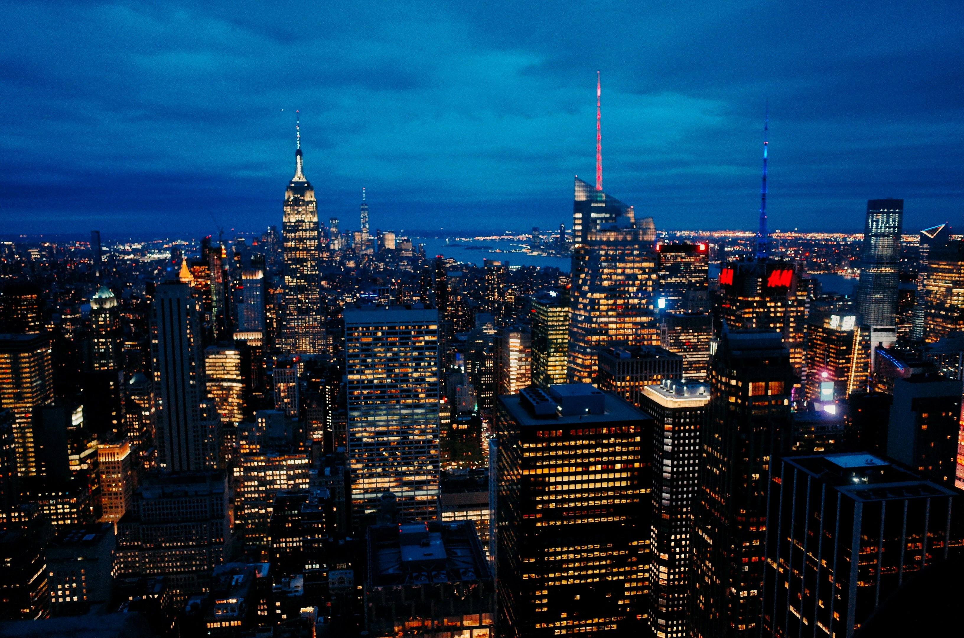 a view of a city at night from the top of a building