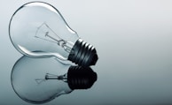 a light bulb sitting on top of a reflective surface