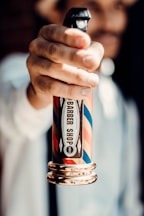 a person holding a lighter in their hand