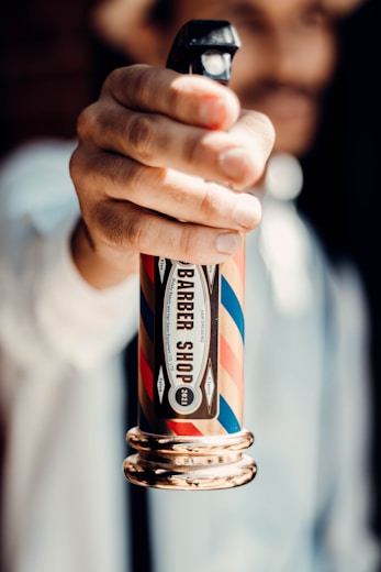 a person holding a lighter in their hand