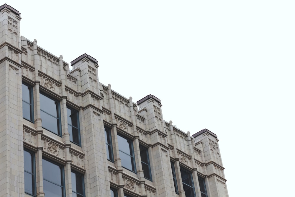 a tall building with a clock on the front of it