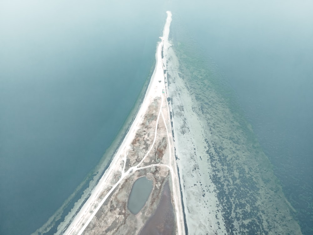 an aerial view of an island in the middle of the ocean