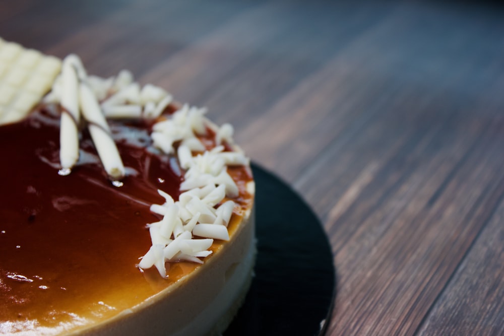 a cheesecake covered in chocolate and white toppings