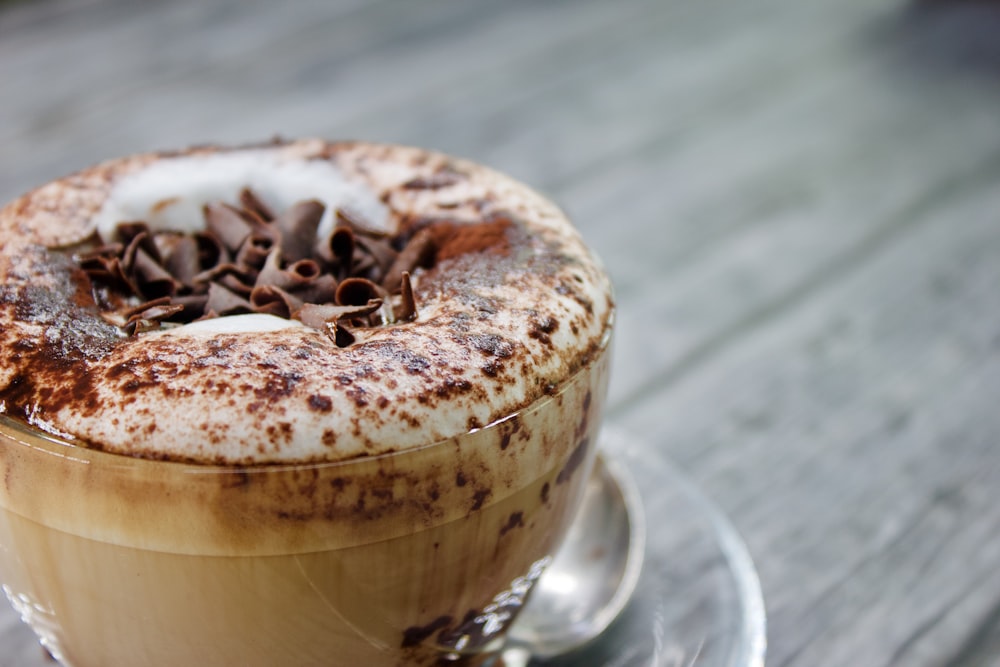 a cup of hot chocolate drink with whipped cream on top