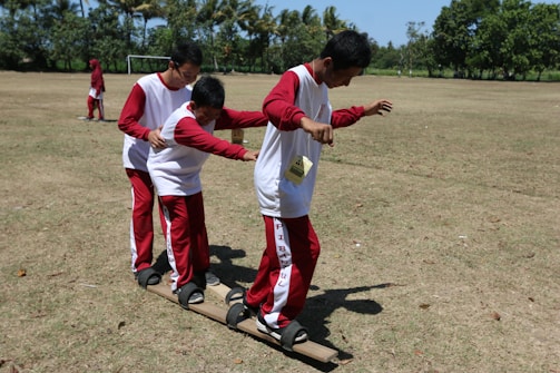 A child happily engaging in a team-building exercise.