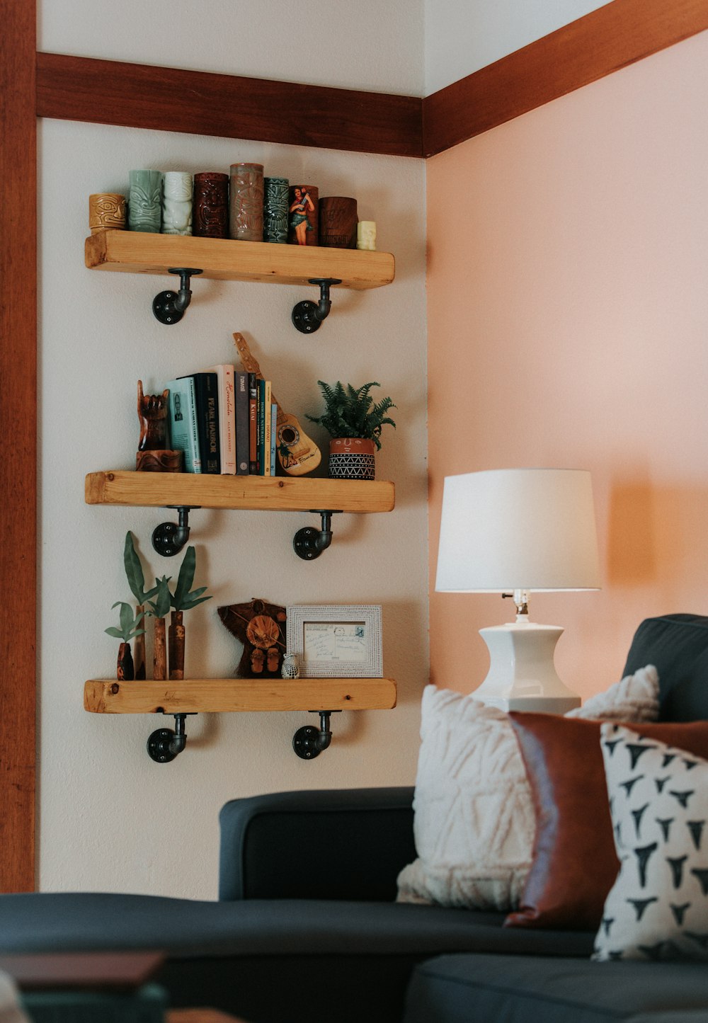 a living room filled with furniture and a lamp