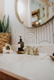 a bathroom sink with a mirror above it