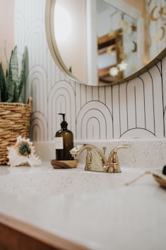 a bathroom sink with a mirror above it