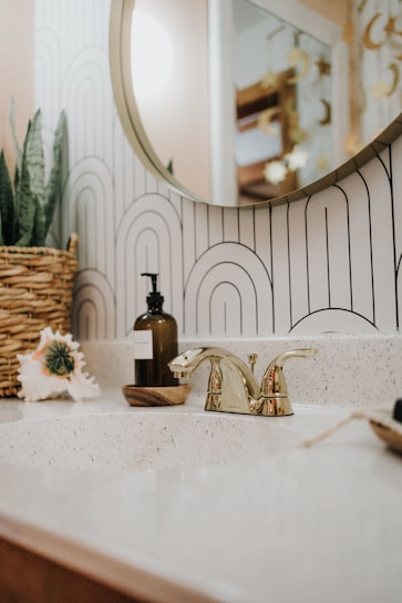 a bathroom sink with a mirror above it