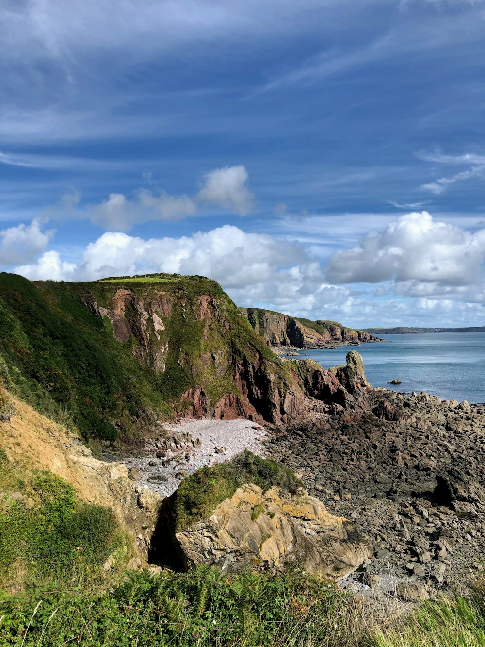 a view of the ocean from a rocky cliff