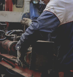 a man working on a piece of machinery