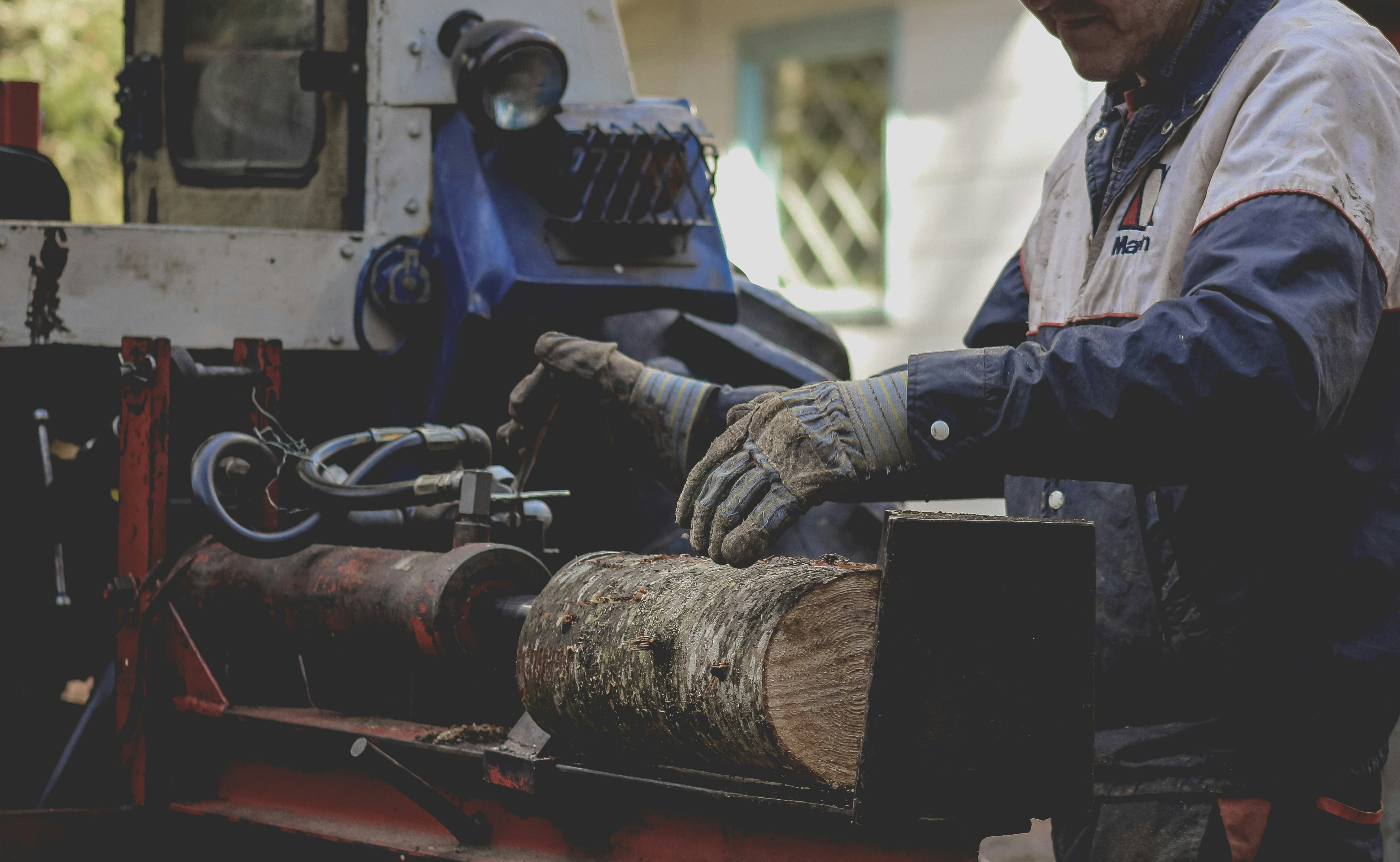 a man is working on a piece of wood