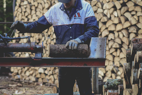 a man is working on a piece of wood