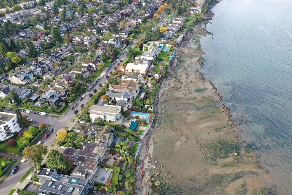 a bird's eye view of a neighborhood by the water