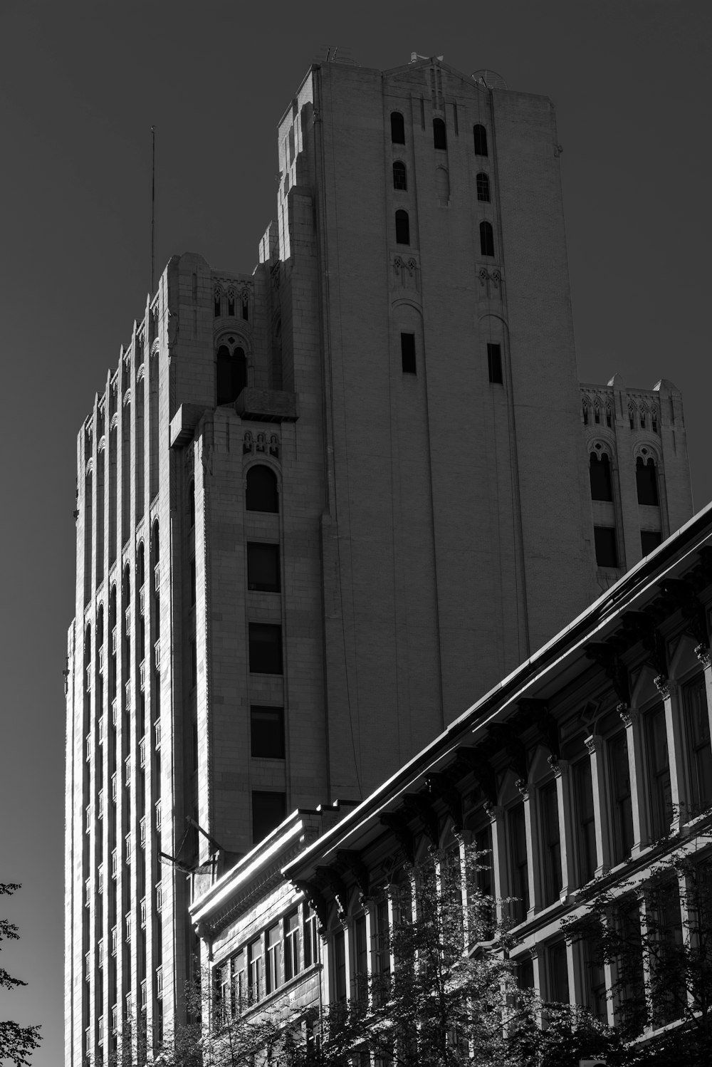 a black and white photo of a tall building