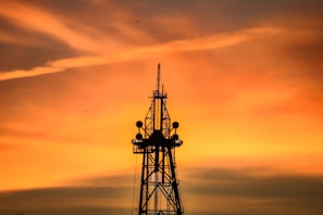 a very tall tower with a sky in the background