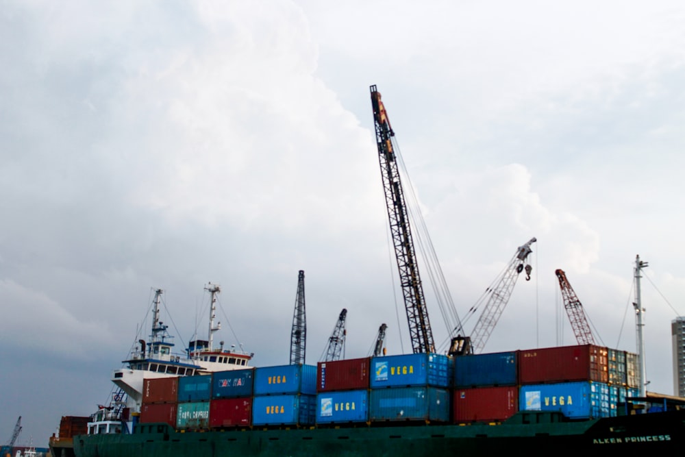 a large cargo ship with a crane on top of it