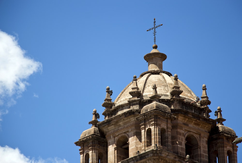 a church steeple with a cross on top