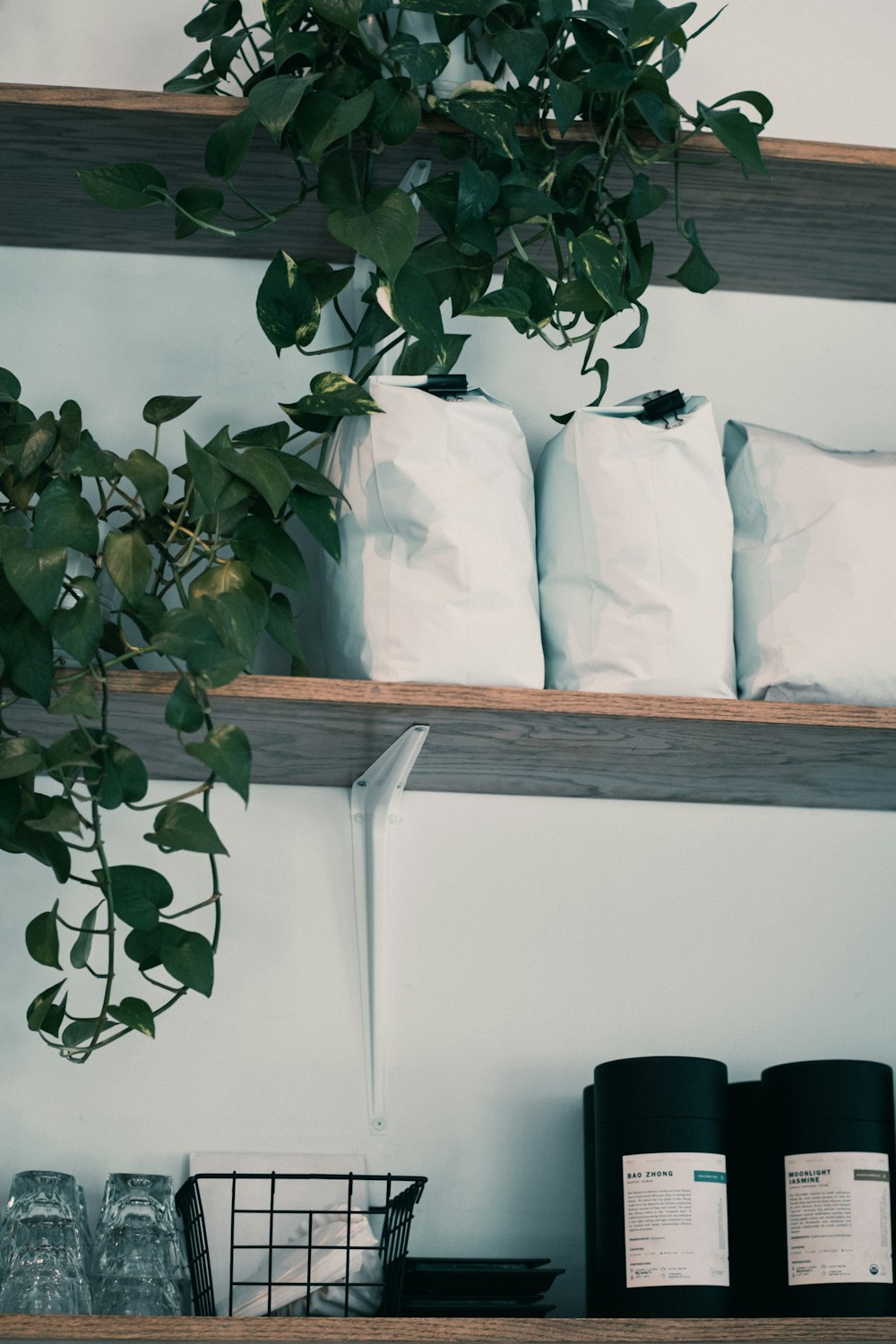 a shelf filled with lots of white bags